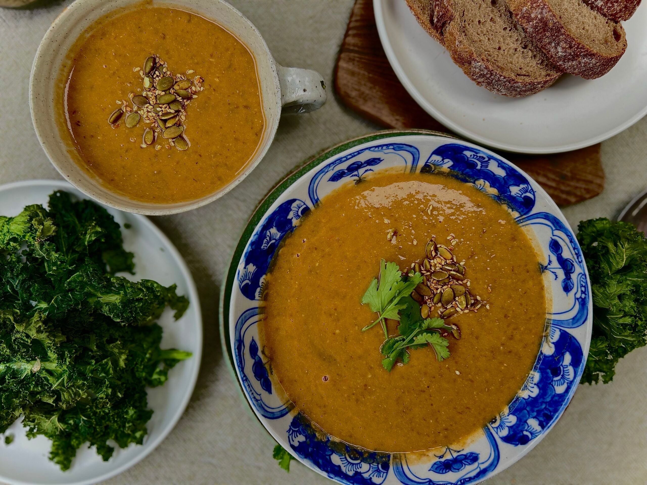 Lentil pumpkin and coconut soup with kale chips