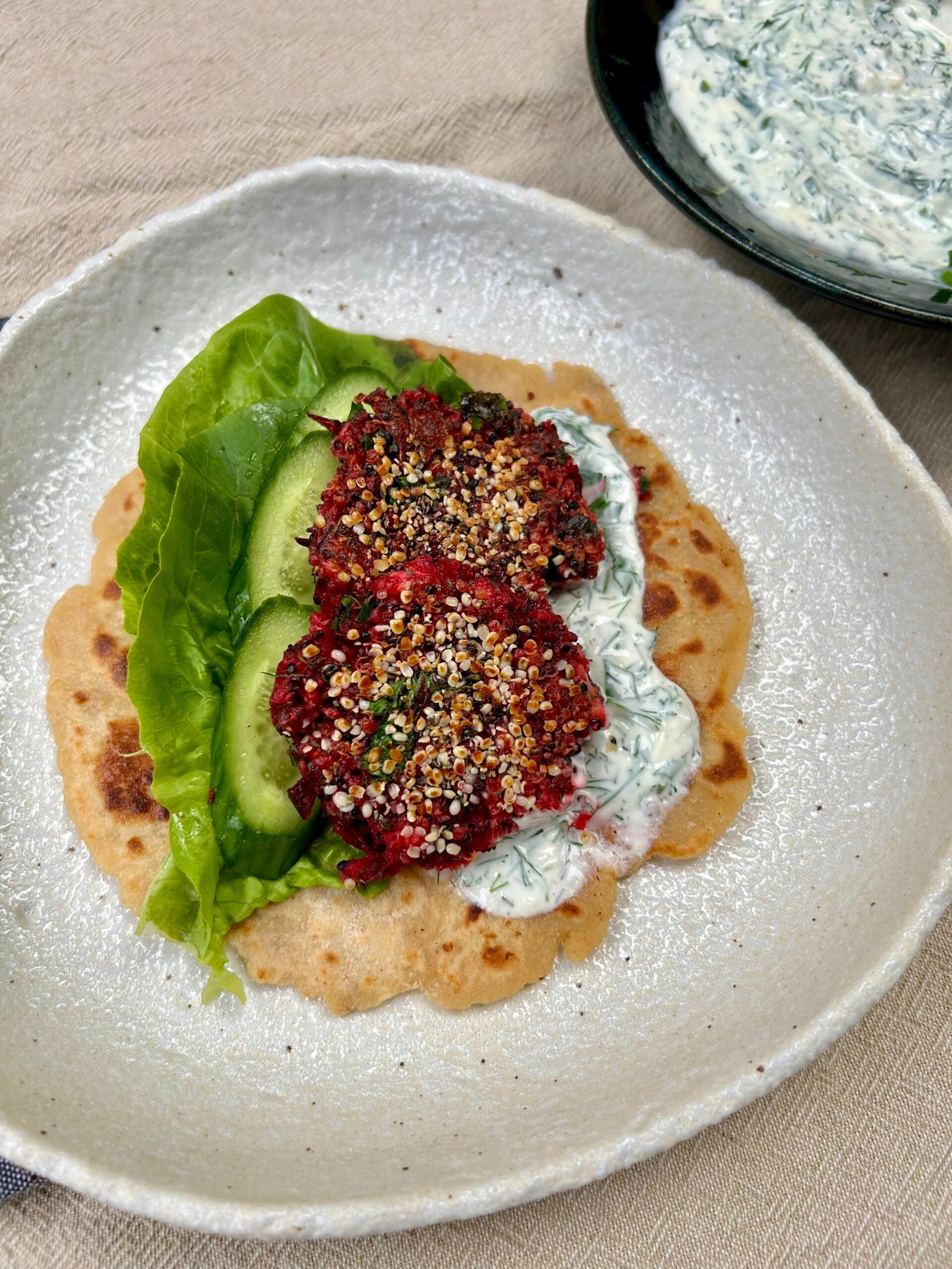Quinoa, feta and beetroot patties with flatbreads and herbed yoghurt